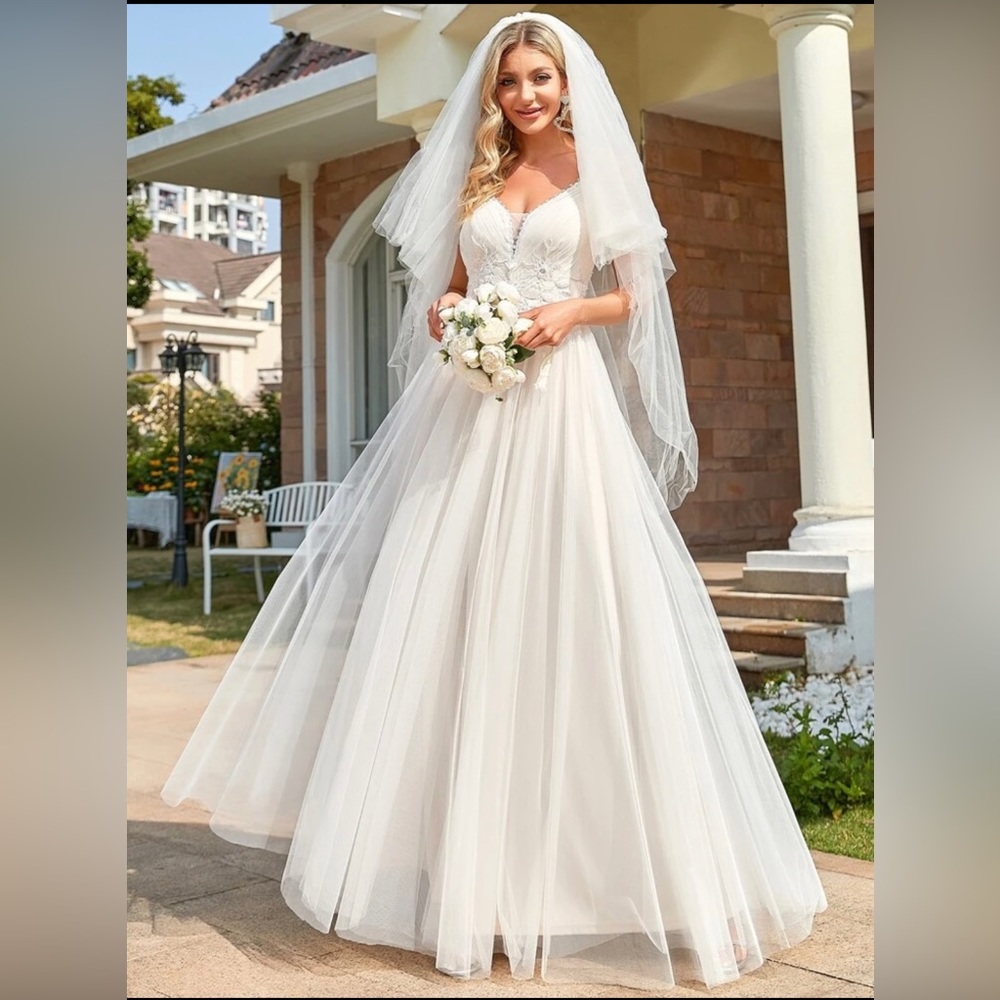 Brand new wedding dress with tags!